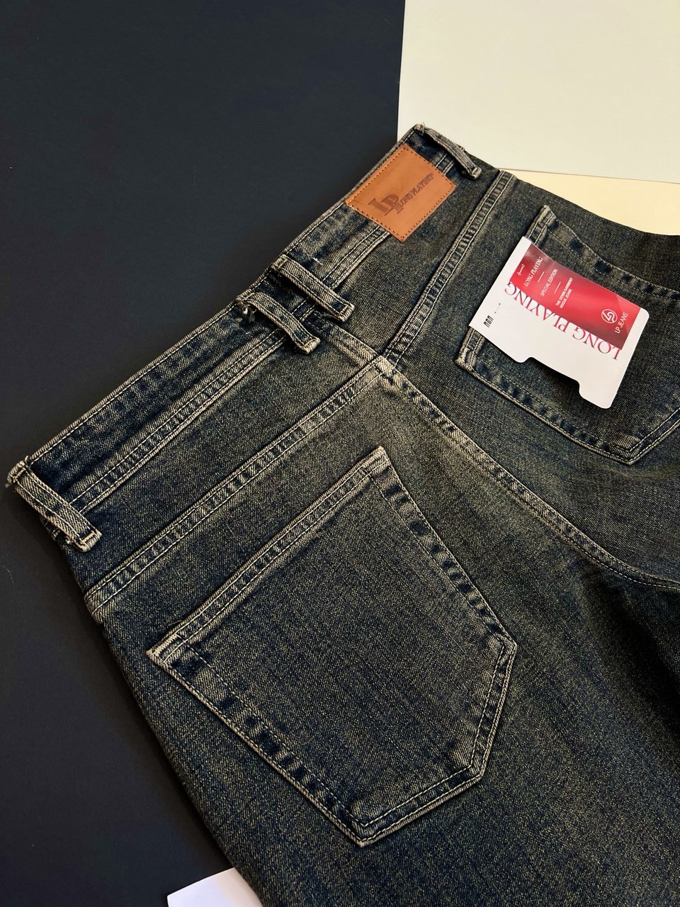 شلوار جین مردانه اسپرت مدل Mini رنگ سرمه‌ای کرم از پارچه لی کشی کج‌راه