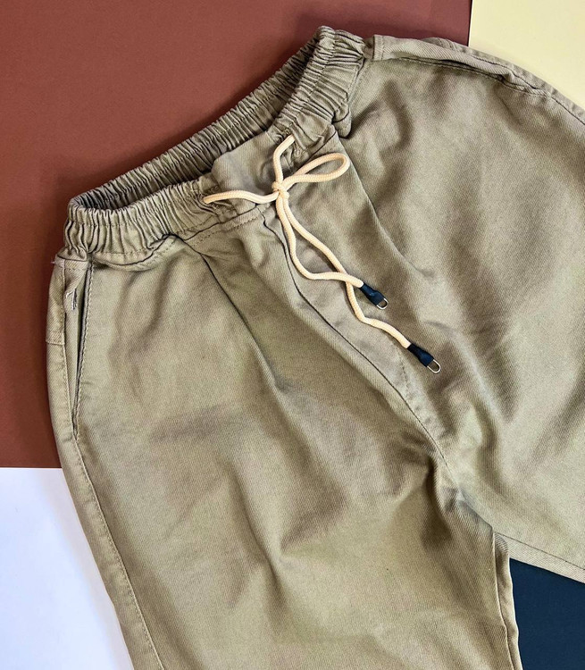 شلوار اسلش کتان مردانه کرم روشن مدل نیمبگ با پاچه گتدار